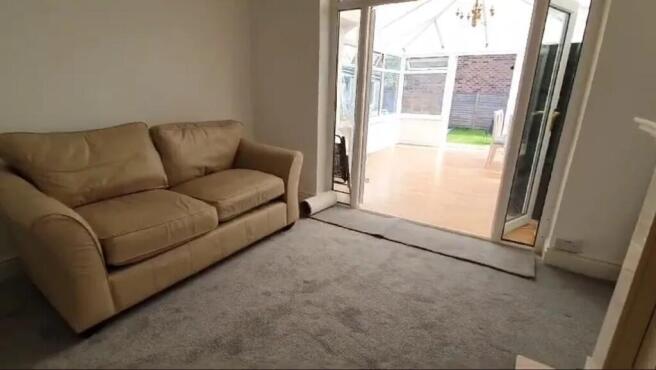 A cozy living room featuring a comfortable sofa...