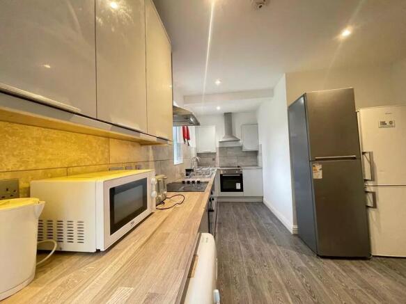 Modern kitchen with ample cabinetry, integrated...