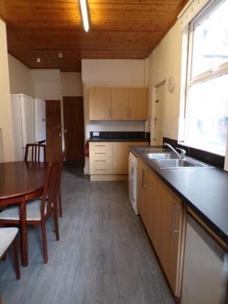 Spacious kitchen featuring ample cabinetry and ...