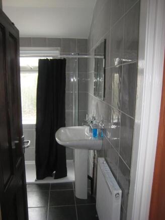 This stylish bathroom features contemporary fix...