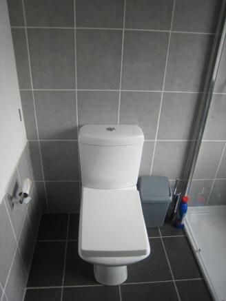 A modern and clean single toilet featuring slee...