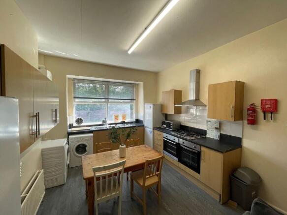 Bright and functional kitchen featuring a large...