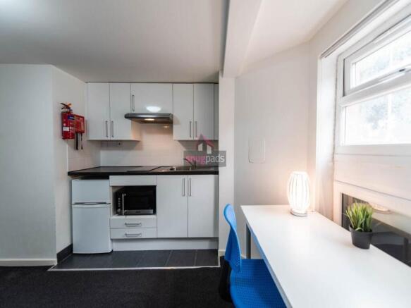 Bright and modern kitchen area featuring sleek ...