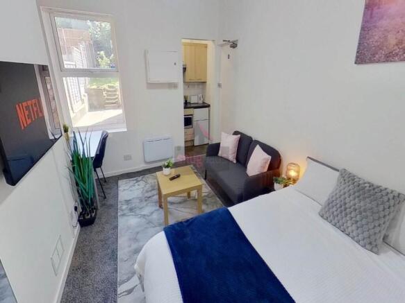 Bright and cozy double bedroom featuring a comf...