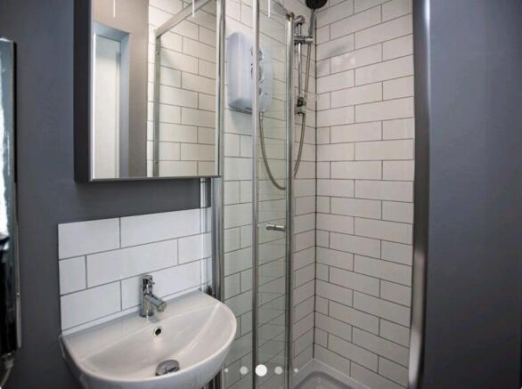 A modern and clean bathroom featuring a compact...