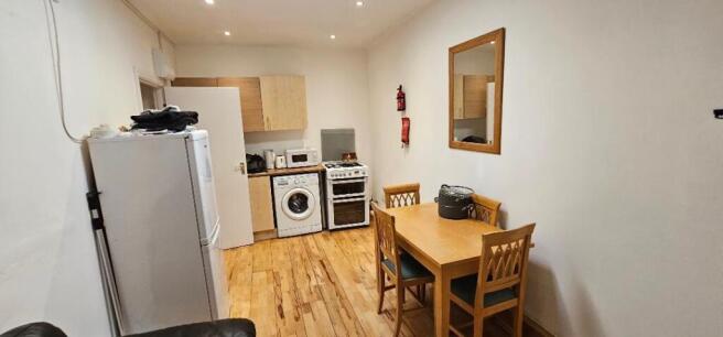 A compact, well-maintained kitchen with essenti...
