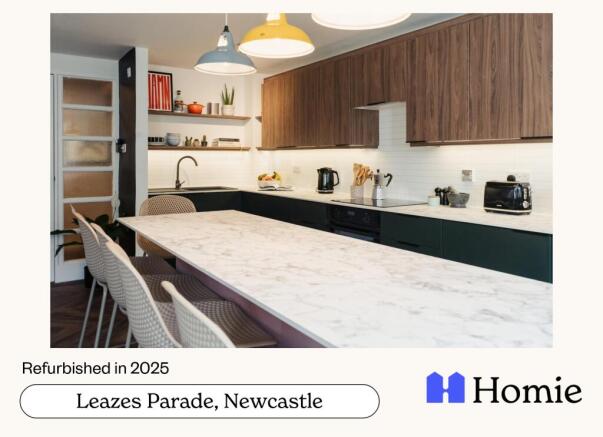 A modern, well-lit kitchen with ample workspace...