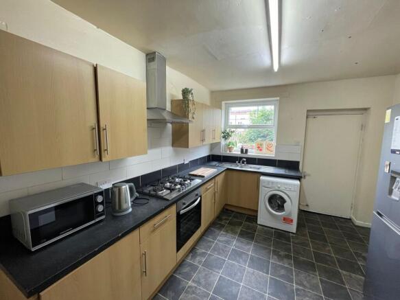 Modern and functional kitchen area with wooden ...