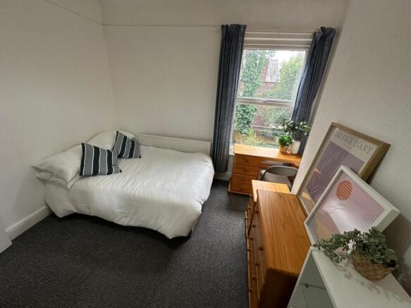 Bright and welcoming double bedroom with a larg...
