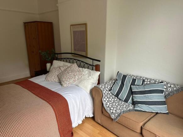 A spacious, well-maintained master bedroom feat...