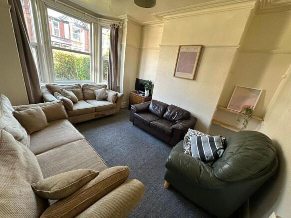 Spacious and bright living room featuring a lar...