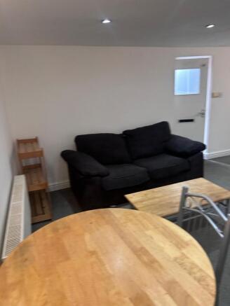 A cozy living room area with a comfortable sofa...