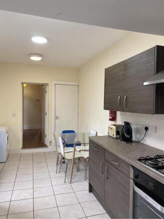 A functional kitchen with modern appliances and...