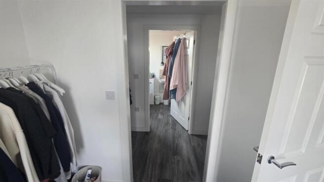 A spacious and bright master bedroom featuring ...