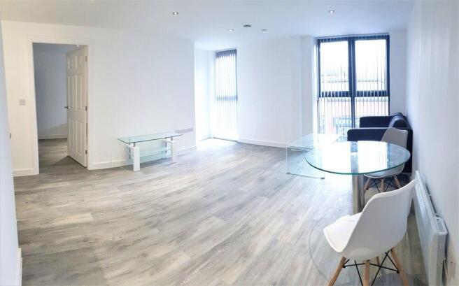 A bright, well-lit contemporary living room wit...