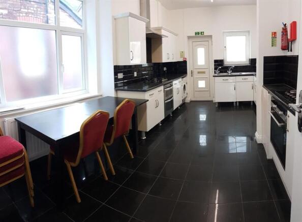 Bright and modern kitchen with ample workspace,...