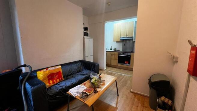 A cozy living room featuring a comfortable sofa...