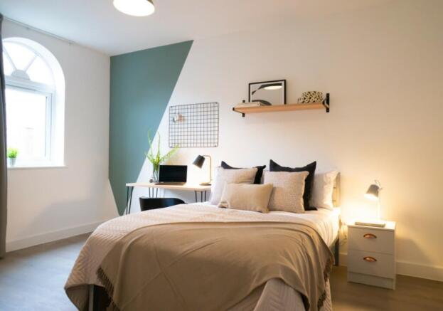 A beautifully designed double bedroom featuring...