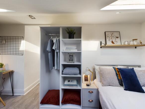 A bright and inviting double bedroom with moder...