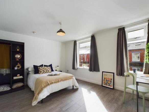 A beautifully designed double bedroom featuring...