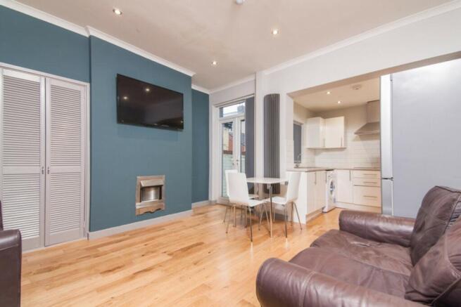 A stylish living room featuring a cozy seating ...