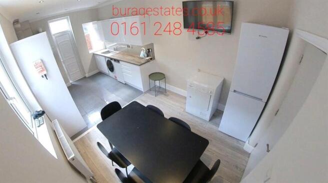 A bright and modern living room featuring ample...