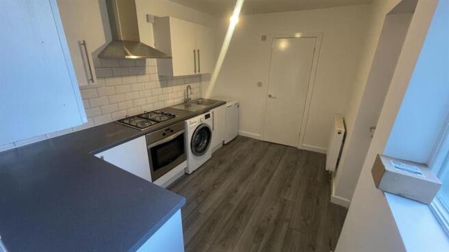 A modern, well-maintained kitchen with ample na...