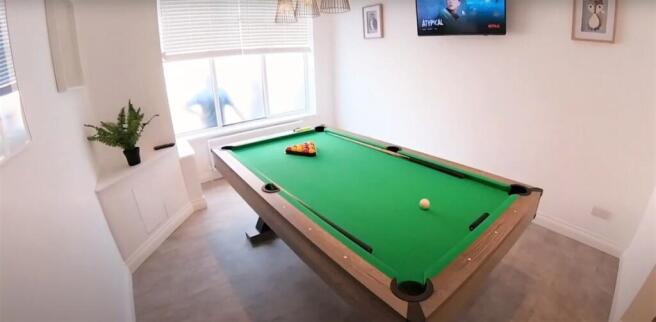 A bright and tidy living room featuring a vibra...