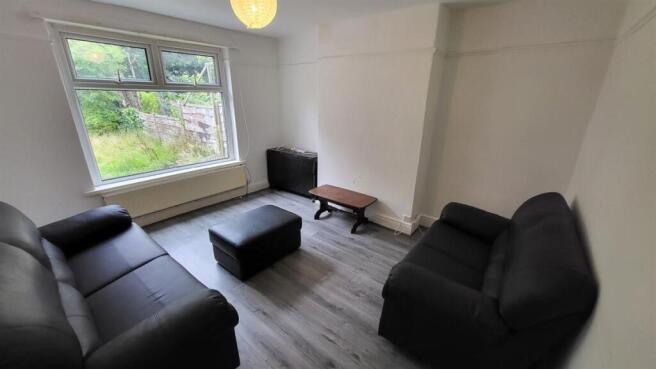 A bright and tidy living room featuring modern ...