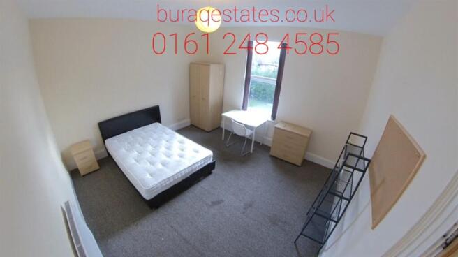 A neat and well-maintained double bedroom featu...