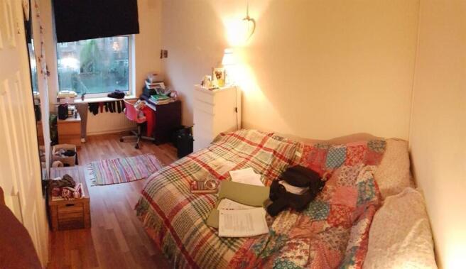 A cozy and welcoming living room featuring a pa...