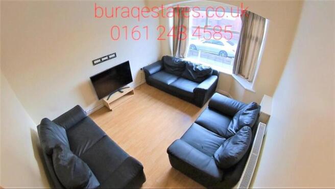 Bright and inviting living room featuring three...