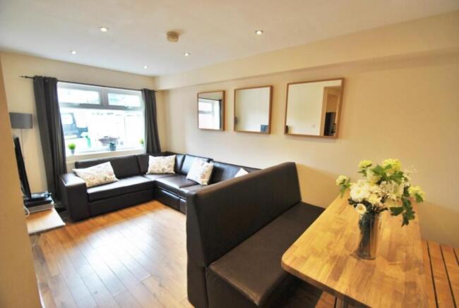 Bright and inviting living room featuring a lar...