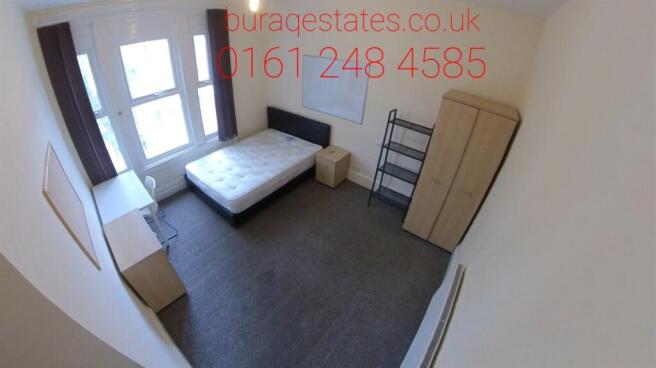 A simple and clean single bedroom featuring a s...