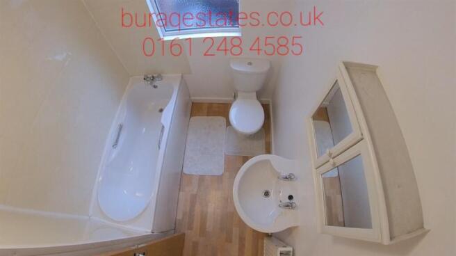 Bright and clean bathroom suite featuring a ful...