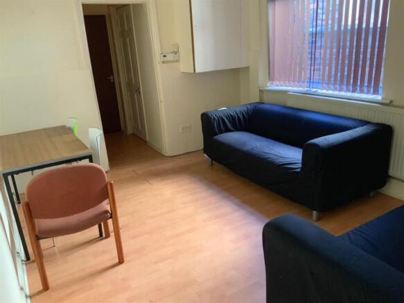 A bright, well-maintained living room featuring...