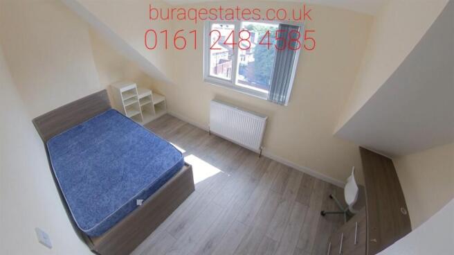 Bright and tidy bedroom with a comfortable doub...