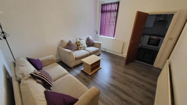 A welcoming and well-maintained living room fea...