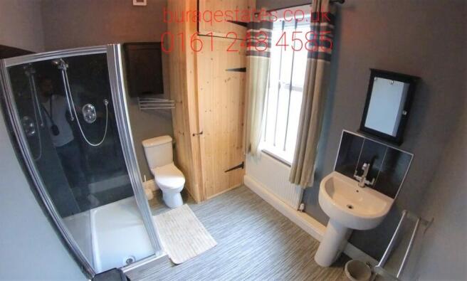 Bright and modern bathroom suite featuring a sp...