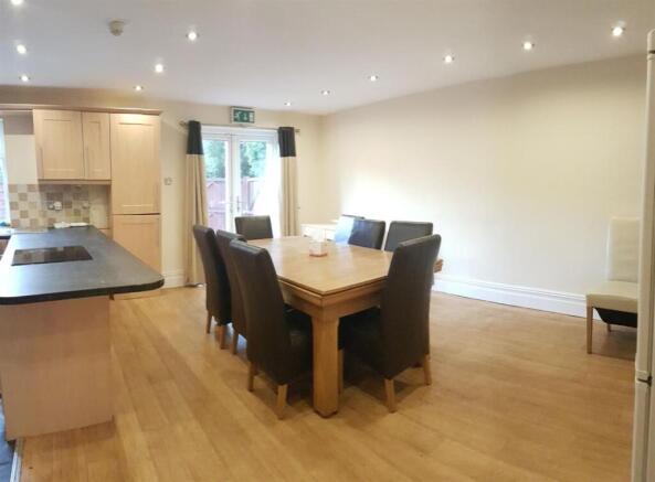 A bright and welcoming dining area with a solid...