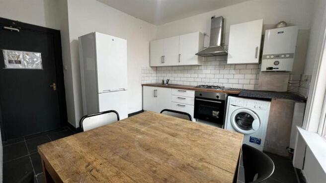 Bright and modern kitchen featuring ample stora...