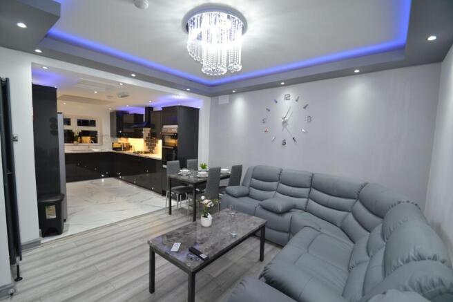 Modern open-plan living area with a large grey ...