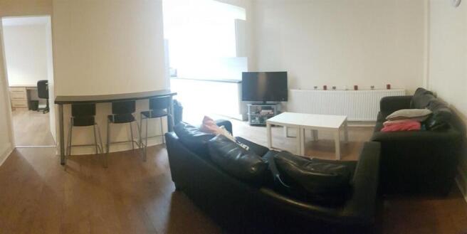 Bright, modern living area with hardwood floors...