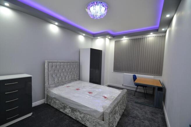 Modern master bedroom featuring a plush, elegan...