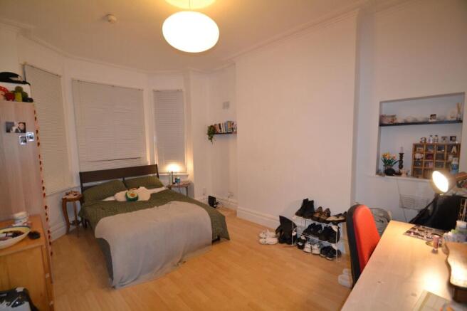 A cozy and welcoming living room featuring a do...