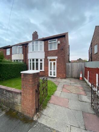 Well-maintained semi-detached brick home with a...