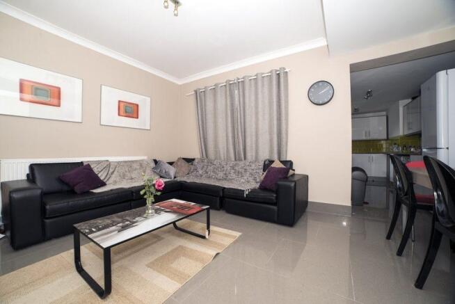 Bright, modern living room with a comfortable b...