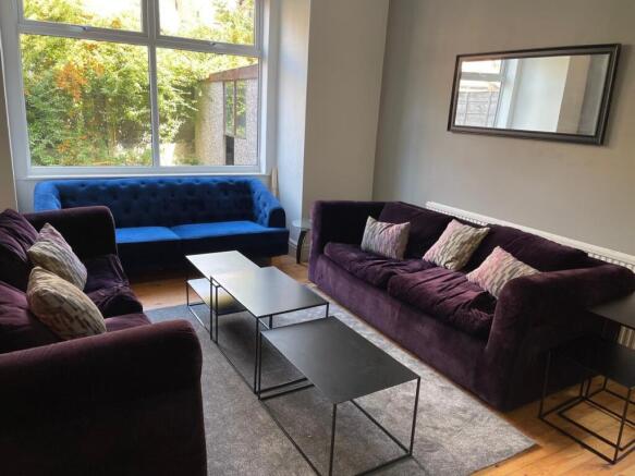 A stylish and inviting living room featuring co...