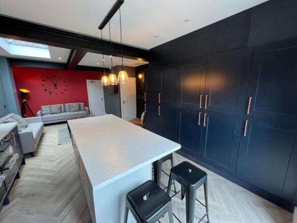 A modern, spacious living room featuring sleek ...