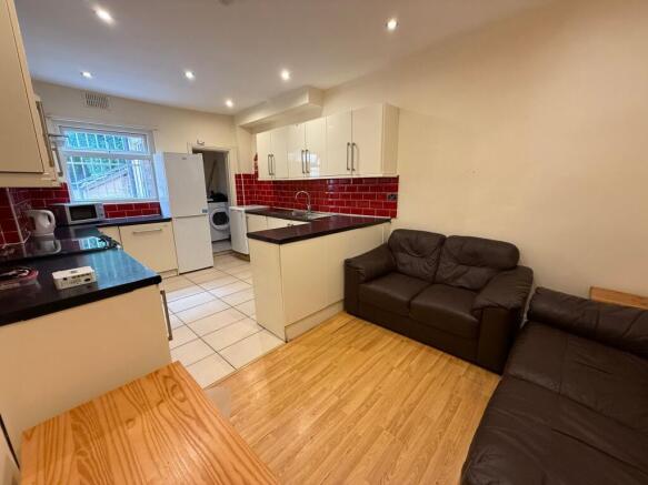 Bright open-plan communal lounge and kitchen wi...